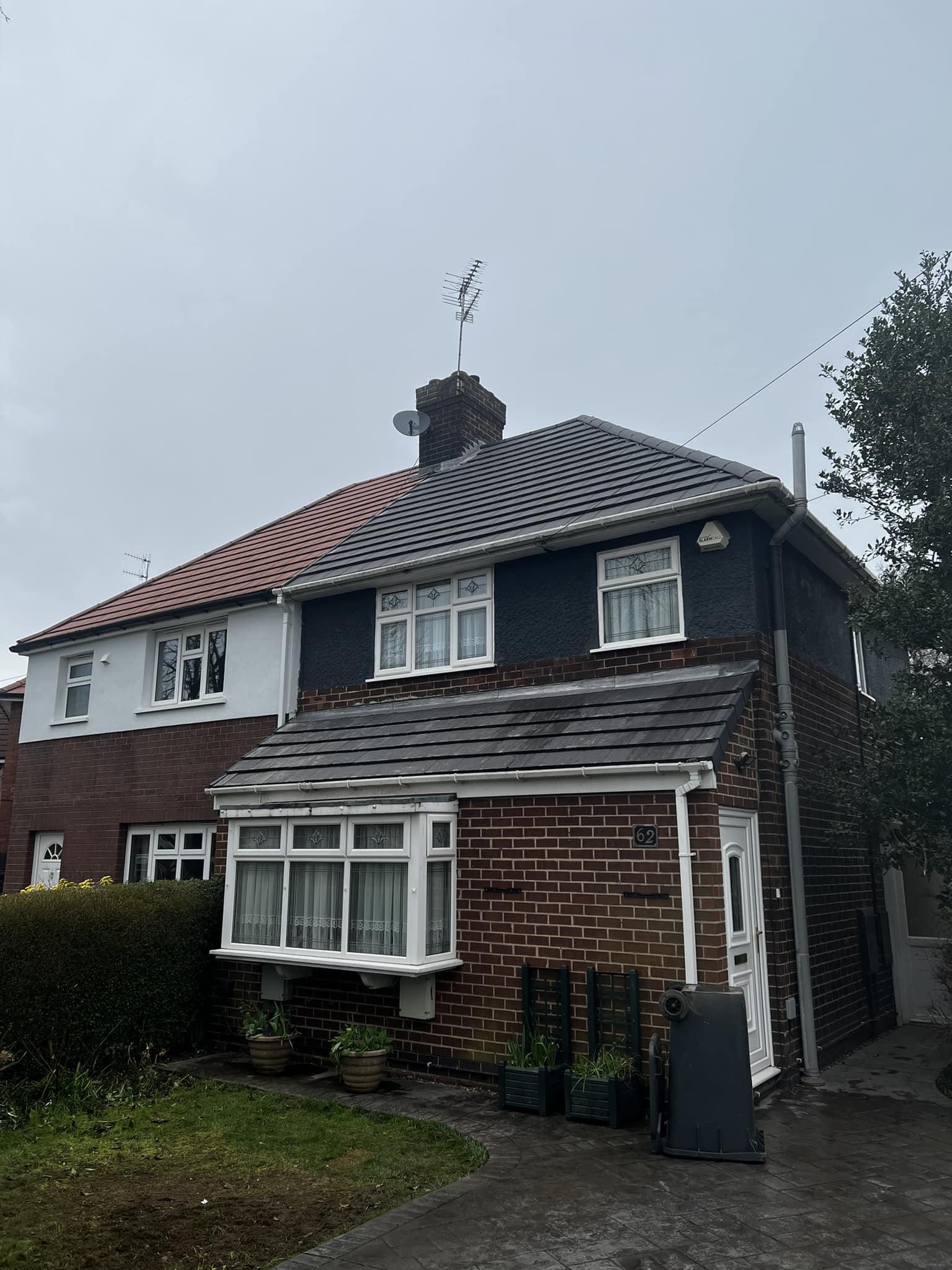 Hipped re-roof with matching render around conservatory completed by BMN Roofing, Derbyshire