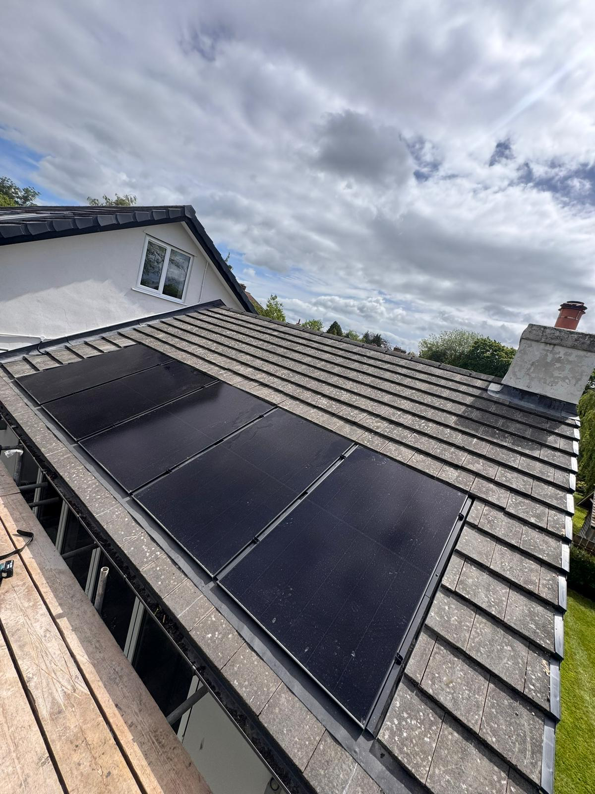 Solar panel installation on tiled roof by BMN Roofing