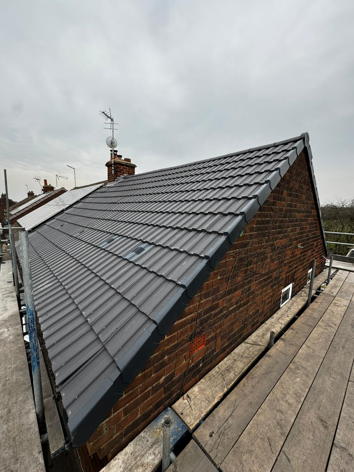 Concrete tile re-roof by BMN Roofing, Derbyshire
